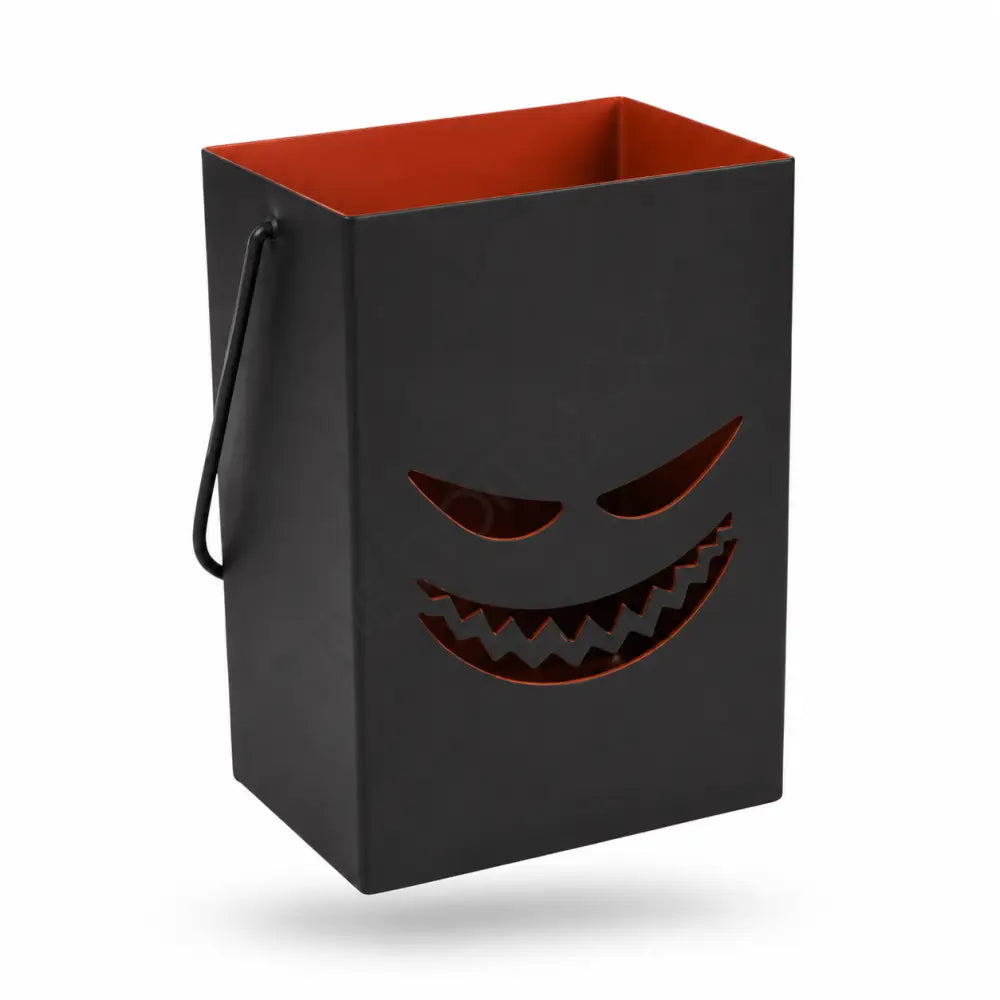 Black Halloween metal lantern bag with a spooky face cutout and orange-red interior for seasonal candle decor. - 2