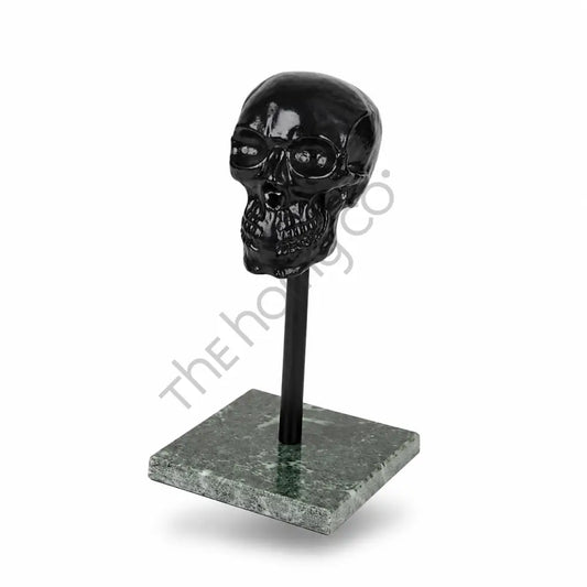 Modern black glossy skull sculpture on a marble base for contemporary home and office decor. - 2