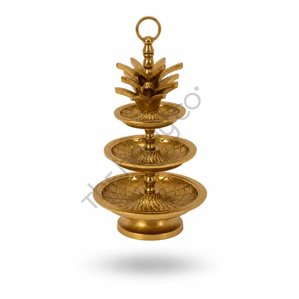 3-tier gold decorative fruit and dessert stand with intricate detailing for elegant tabletop serving. - 2