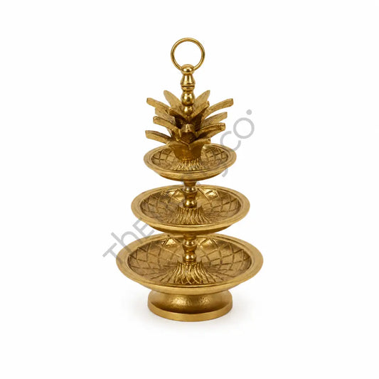 3-tier gold decorative fruit and dessert stand with intricate detailing for elegant tabletop serving.