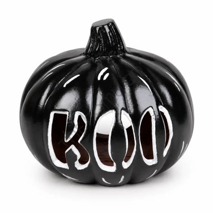 Glossy black "BOO" pumpkin decoration with a modern gothic cutout design for Halloween home decor.