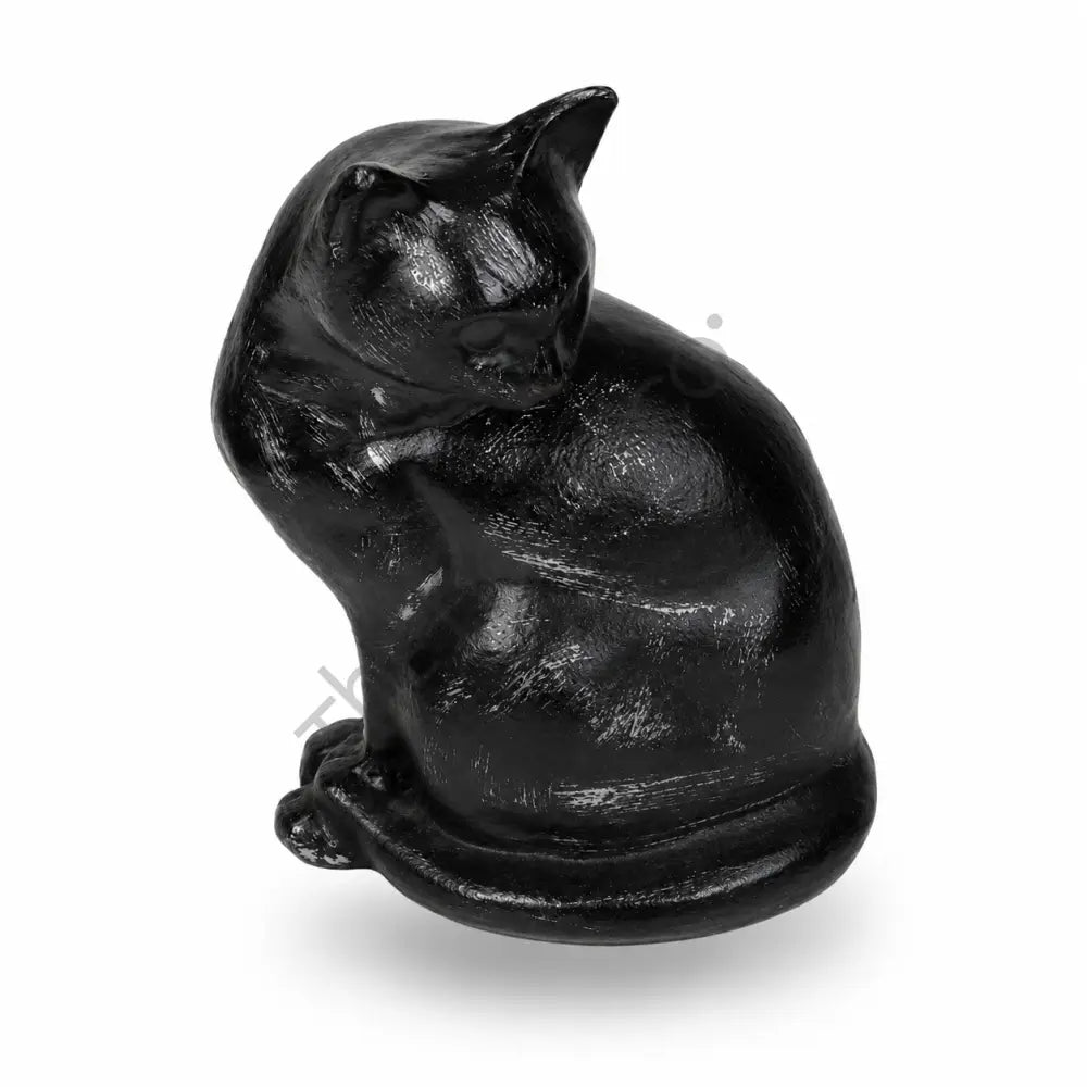 Sleek glossy black sitting cat sculpture with a curled tail for modern home decor. - 2