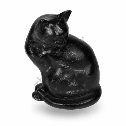 Sleek glossy black sitting cat sculpture with a curled tail for modern home decor. - 2