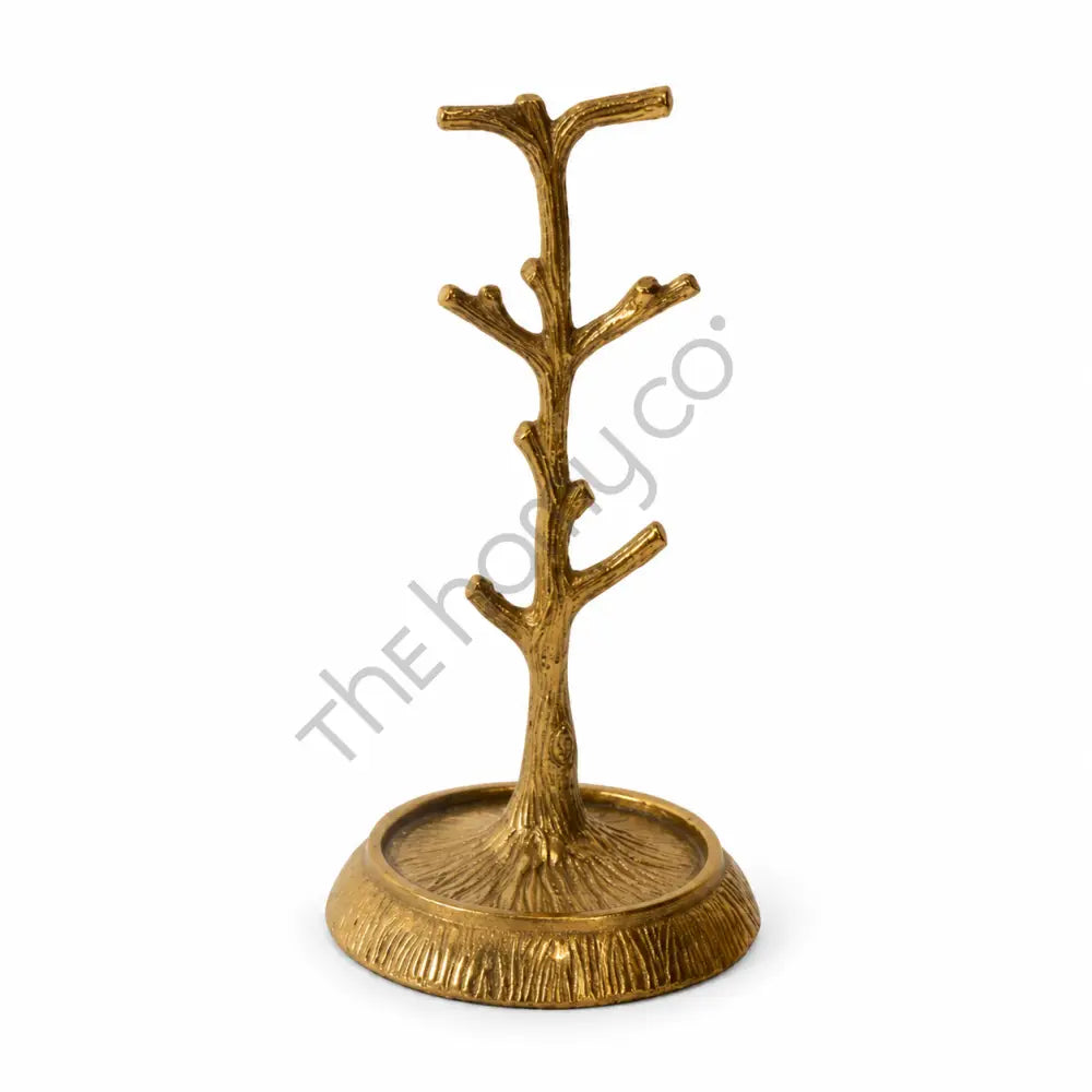 Elegant gold tree jewelry stand and metal organizer for rings, necklaces, and bracelets.