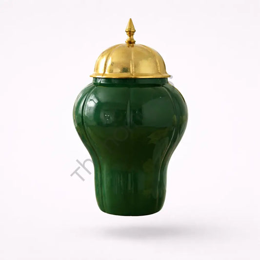 Elegant green ceramic storage jar with a luxury gold lid for sophisticated home decor.