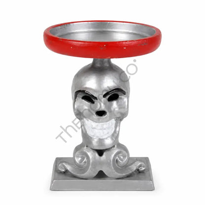 Silver decorative skull candle holder with a red enamel tray for gothic Halloween home decor.