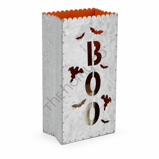 Galvanized silver metal BOO luminary lantern bag with bat cutouts and orange interior for Halloween decor.