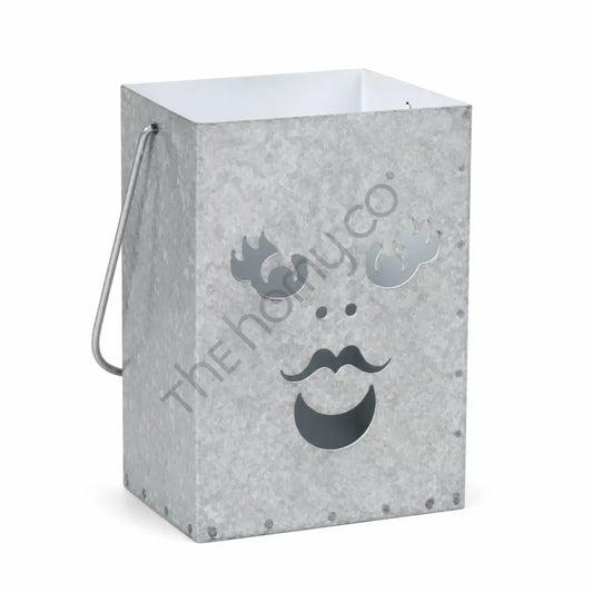 Rustic galvanized metal Halloween ghost lantern bucket with a spooky cutout face for holiday home decor.