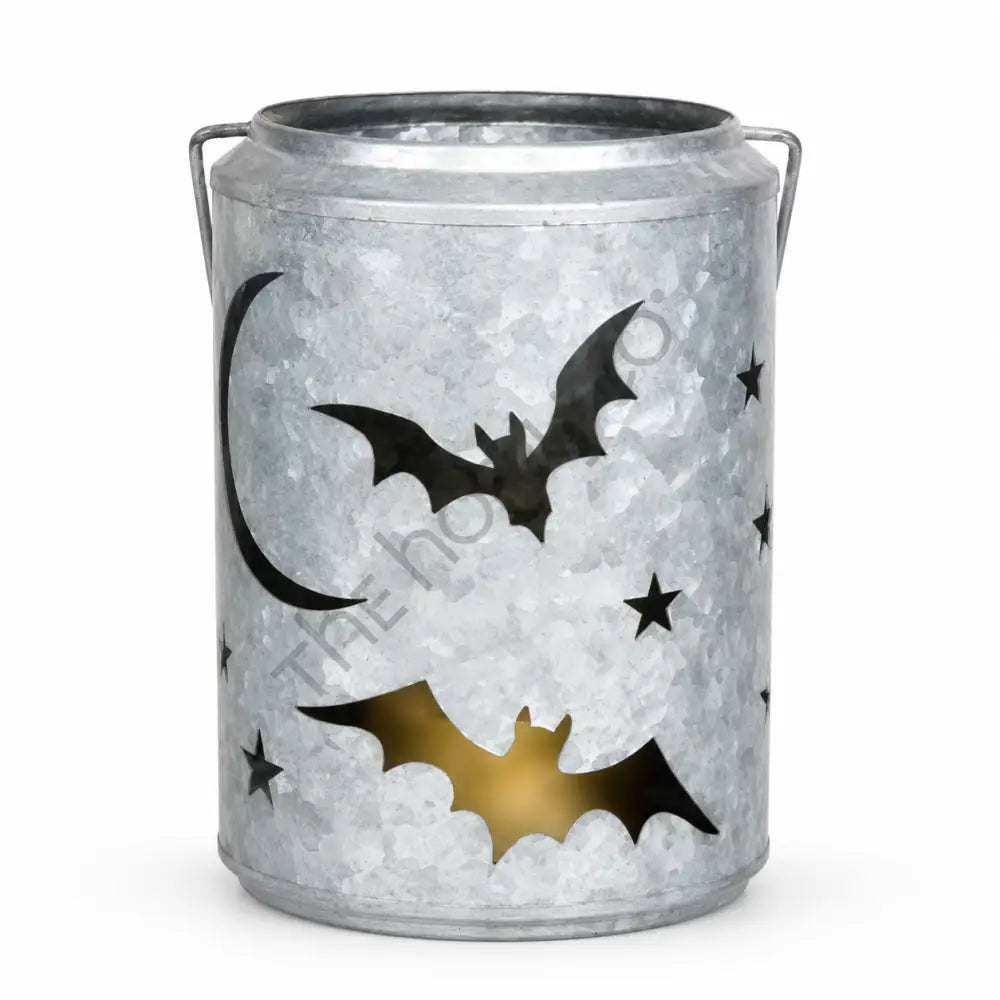 Galvanized metal Halloween lantern bucket with bat and star cutouts for rustic farmhouse decor.