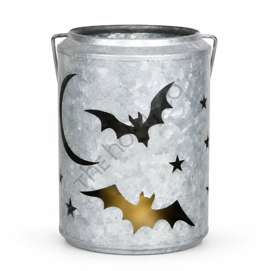 Galvanized metal Halloween lantern bucket with bat and star cutouts for rustic farmhouse decor.