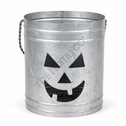 Rustic galvanized metal pumpkin jack-o-lantern lantern bucket for Halloween home decor.