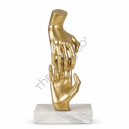 Elegant gold abstract hand sculpture on a premium marble base for modern home and office decor.