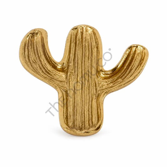 Gold cactus shaped decorative tray for jewelry and trinket organization.