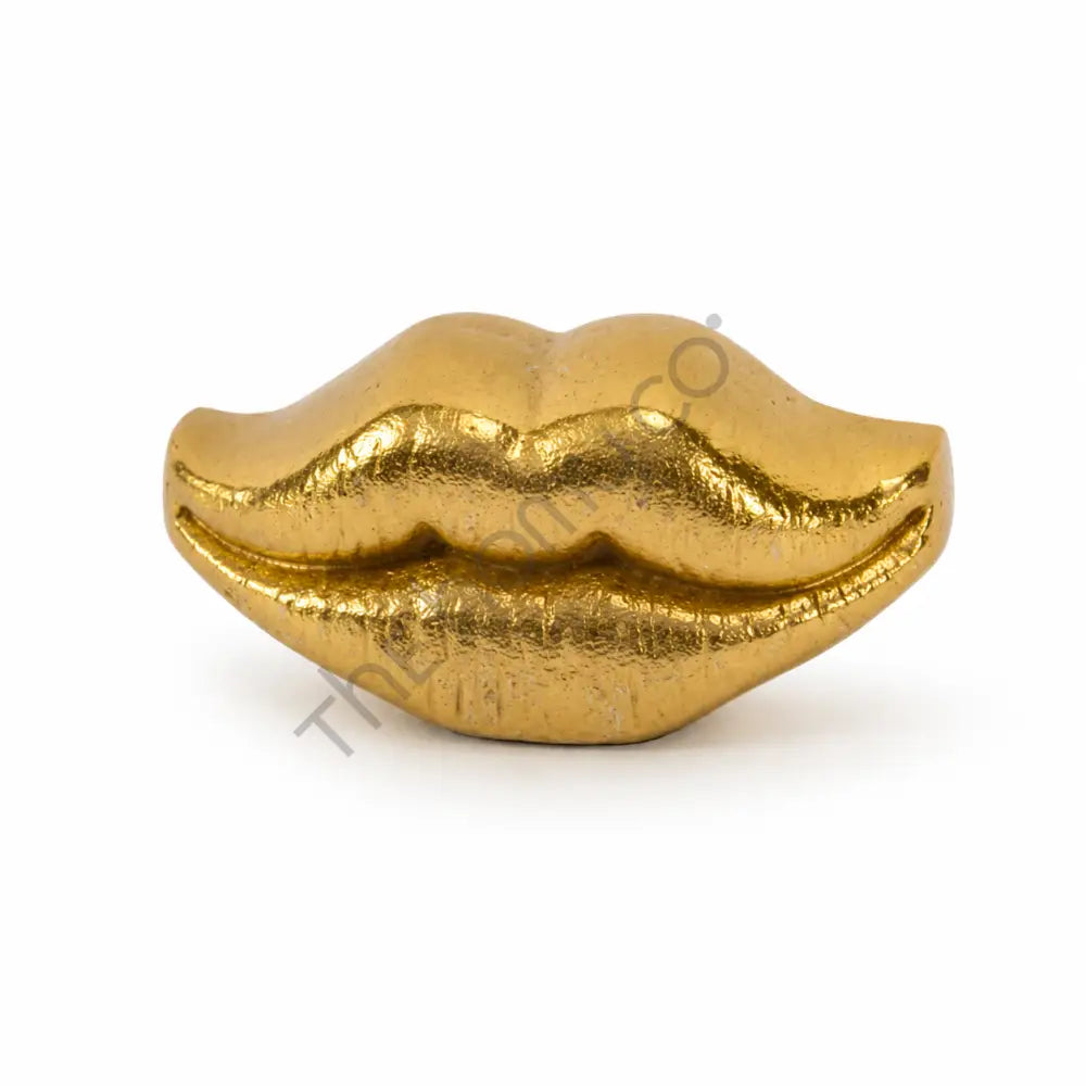 Modern gold lips decorative sculpture with a metallic finish for contemporary home decor.