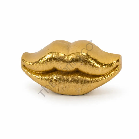 Modern gold lips decorative sculpture with a metallic finish for contemporary home decor.