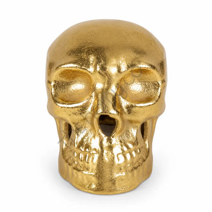 Modern gold skull decorative showpiece with a metallic finish for luxury gothic home decor.