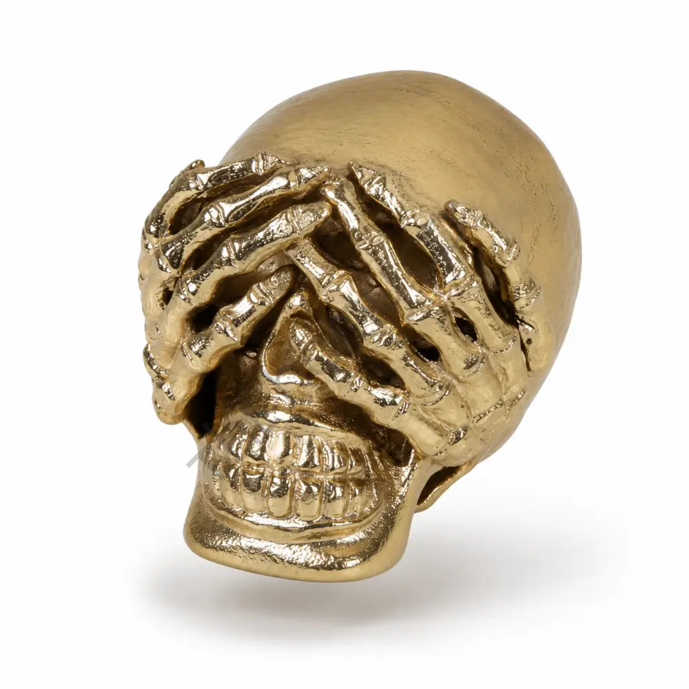 Artistic gold skull showpiece with hand-over-eyes design for modern home decor. - 2