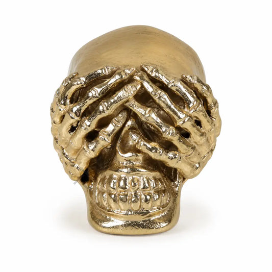 Artistic gold skull showpiece with hand-over-eyes design for modern home decor.
