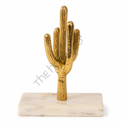 Elegant golden cactus showpiece with a metallic finish on a premium white marble base for modern home decor.