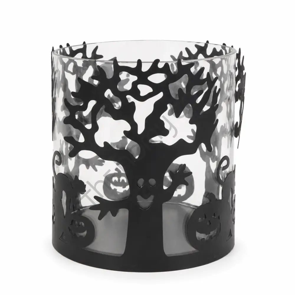 Halloween glass candle holder featuring a black tree silhouette and pumpkin details for spooky festive decor.