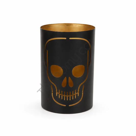 Black metal skull candle holder with gothic cutout design and gold interior for Halloween decor.