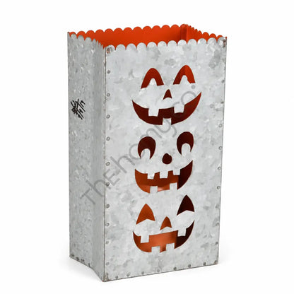 Galvanized metal Halloween jack-o-lantern treat bag lantern with stacked pumpkin cutouts and orange interior for festive home decor.