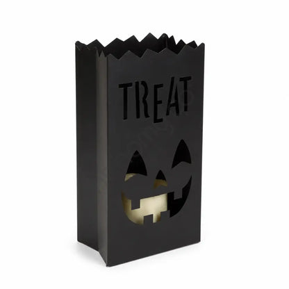 Matte black "Treat" bag-style metal lantern holder with smiling jack-o-lantern cutout for Halloween decor.
