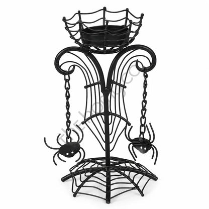 Black metal Halloween spider web candle holder stand with hanging spider ornaments for gothic home decor.