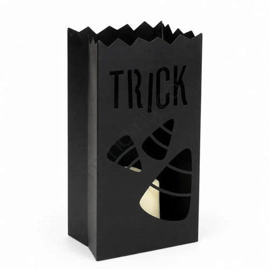Matte black metal Halloween lantern with TRICK and candy corn cutouts for festive home decor.