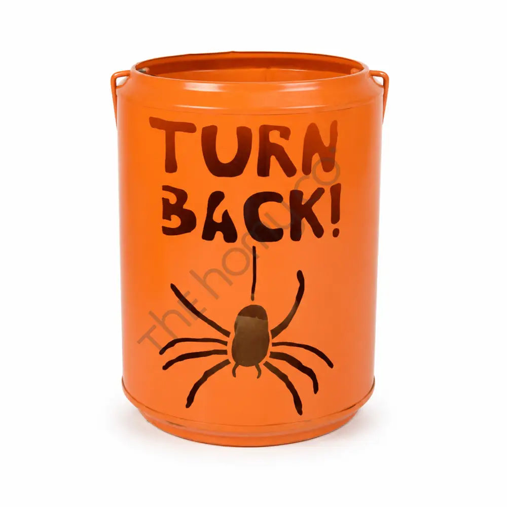 Orange Halloween trick-or-treat metal candy bucket with spider artwork and Turn Back text for spooky party decor.