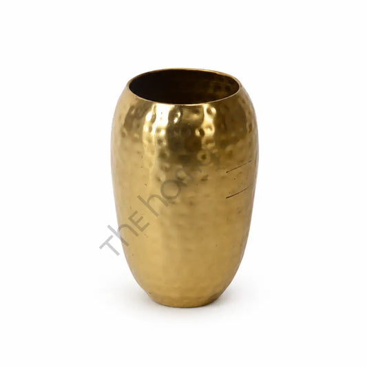 Hammered gold metal vase with a textured finish for luxury home decor and flower arrangements.