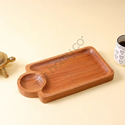 Handcrafted wooden serving platter with integrated dip bowl for snacks and appetizers.