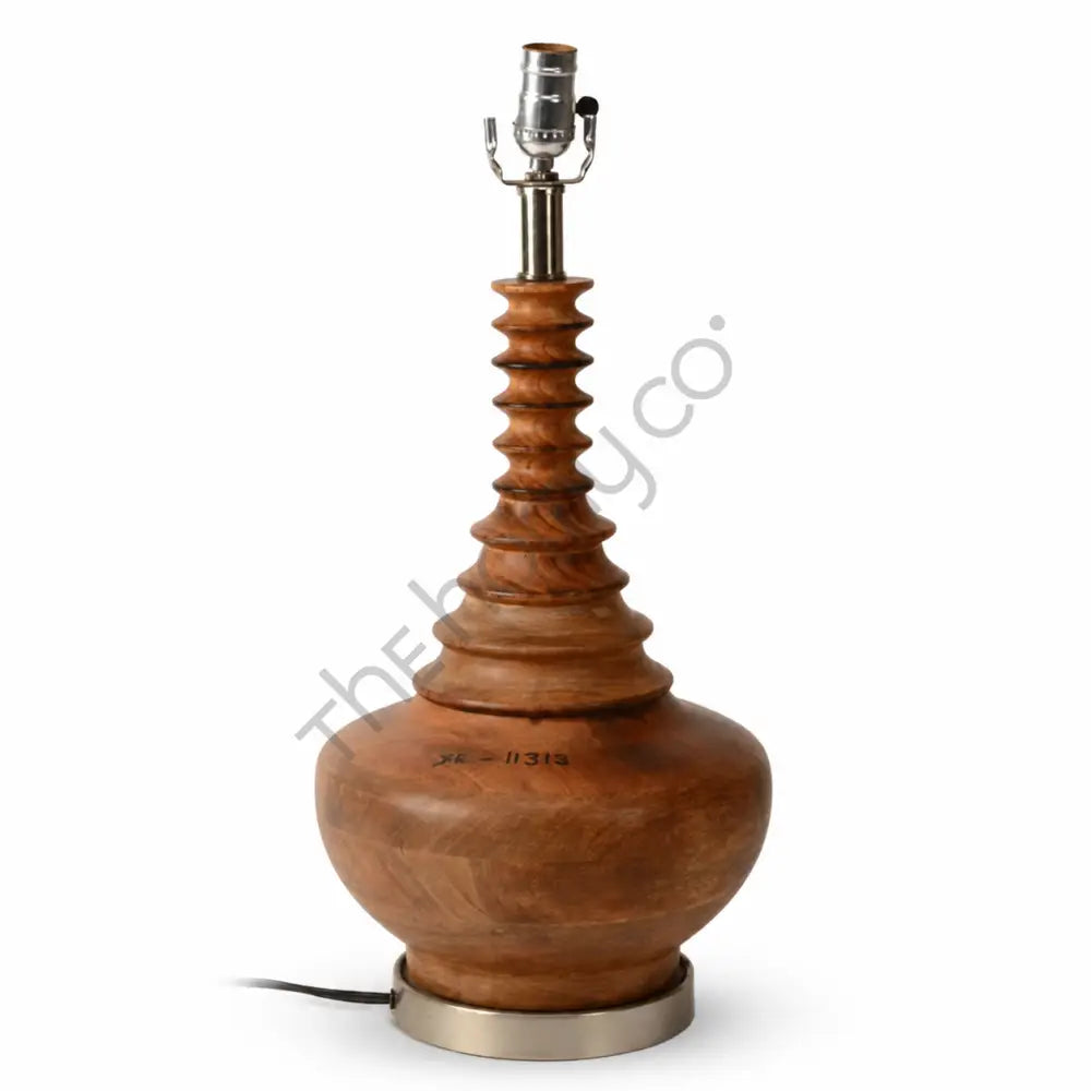 Handcrafted wooden table lamp base with natural wood grain and a sturdy metal base for rustic interior decor.