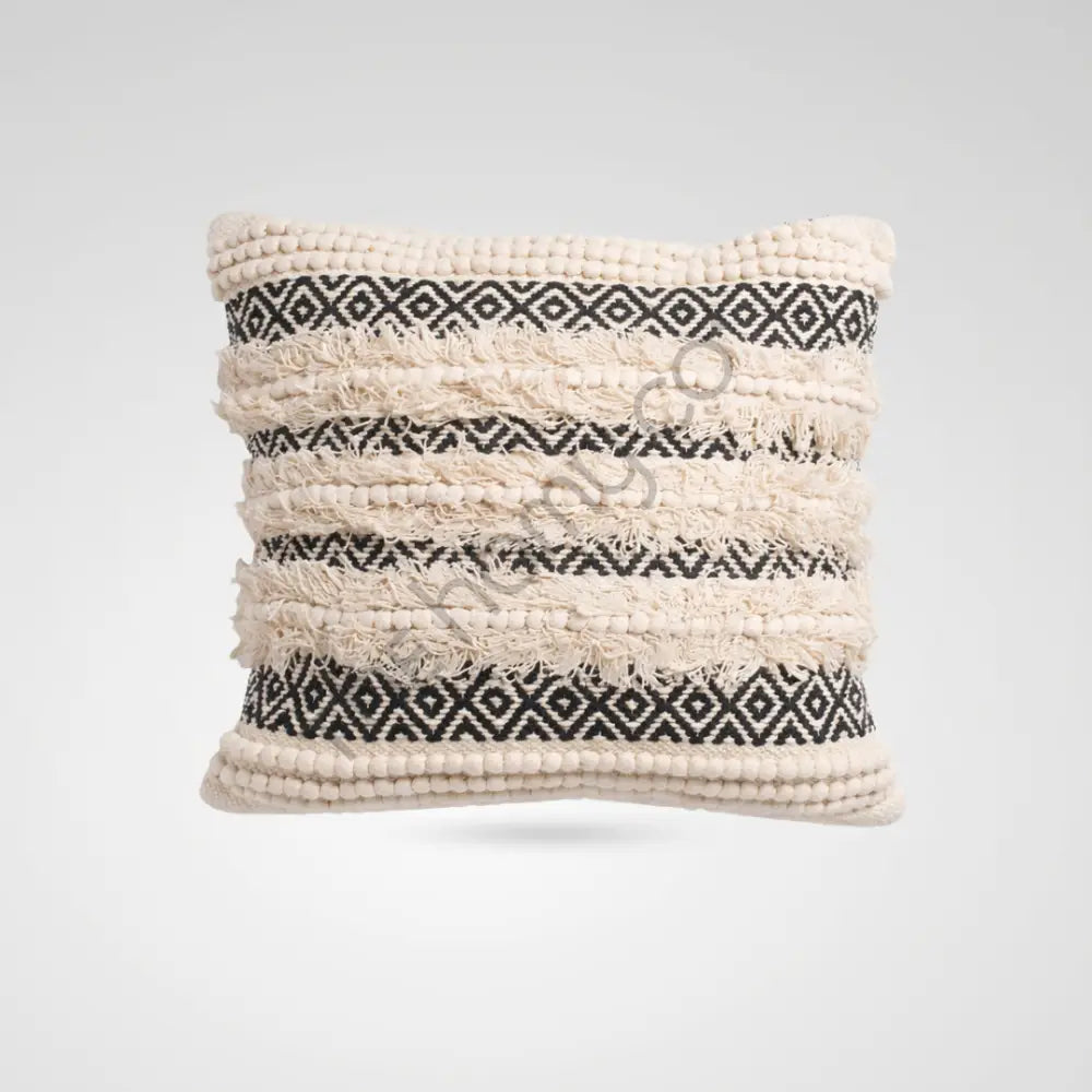 Handwoven black and white geometric cotton cushion cover with tufted textures for boho home decor.