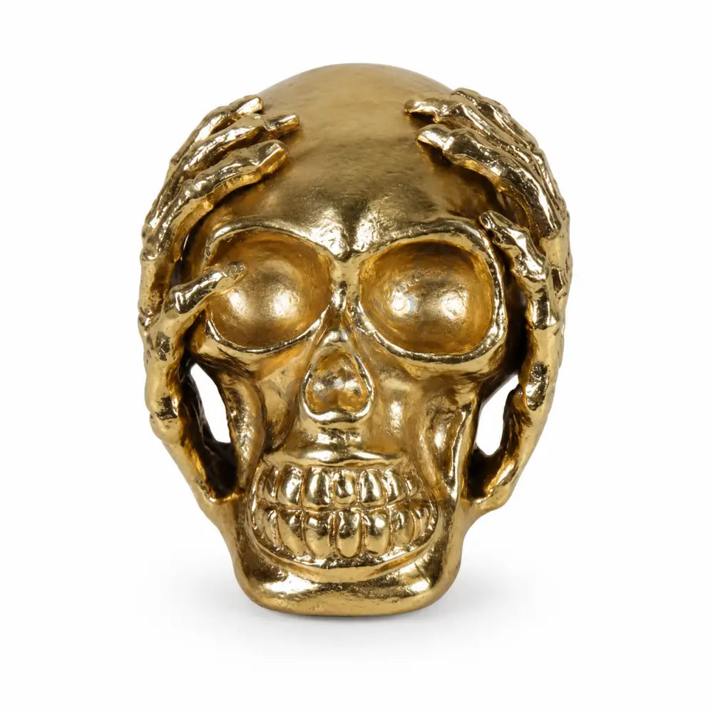 Luxury gold skull sculpture with hand-over-eyes design for modern home and office decor.