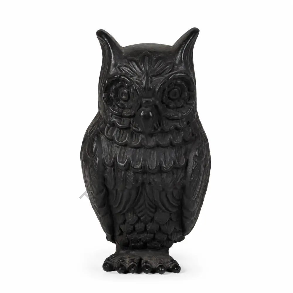Elegant matte black owl showpiece with intricate feather detailing for modern home and office decor.