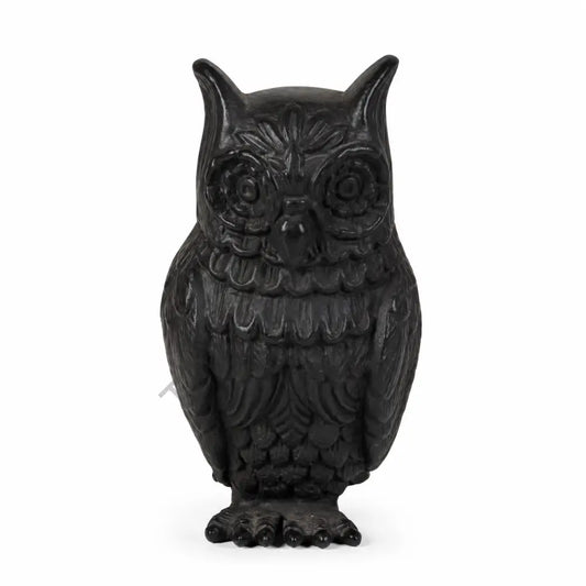 Elegant matte black owl showpiece with intricate feather detailing for modern home and office decor.