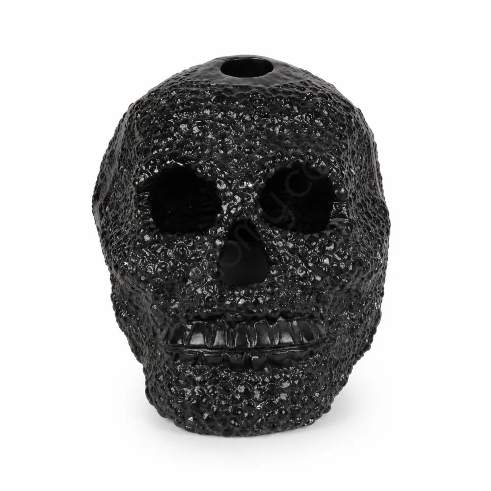 Matte black textured skull showpiece with a unique dotted surface for modern gothic home decor.