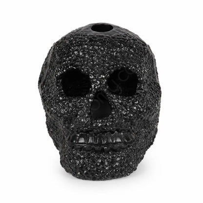 Matte black textured skull showpiece with a unique dotted surface for modern gothic home decor.