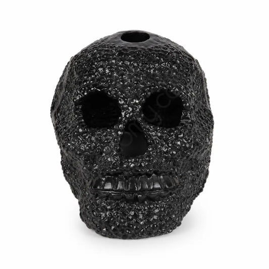 Matte black textured skull showpiece with a unique dotted surface for modern gothic home decor.