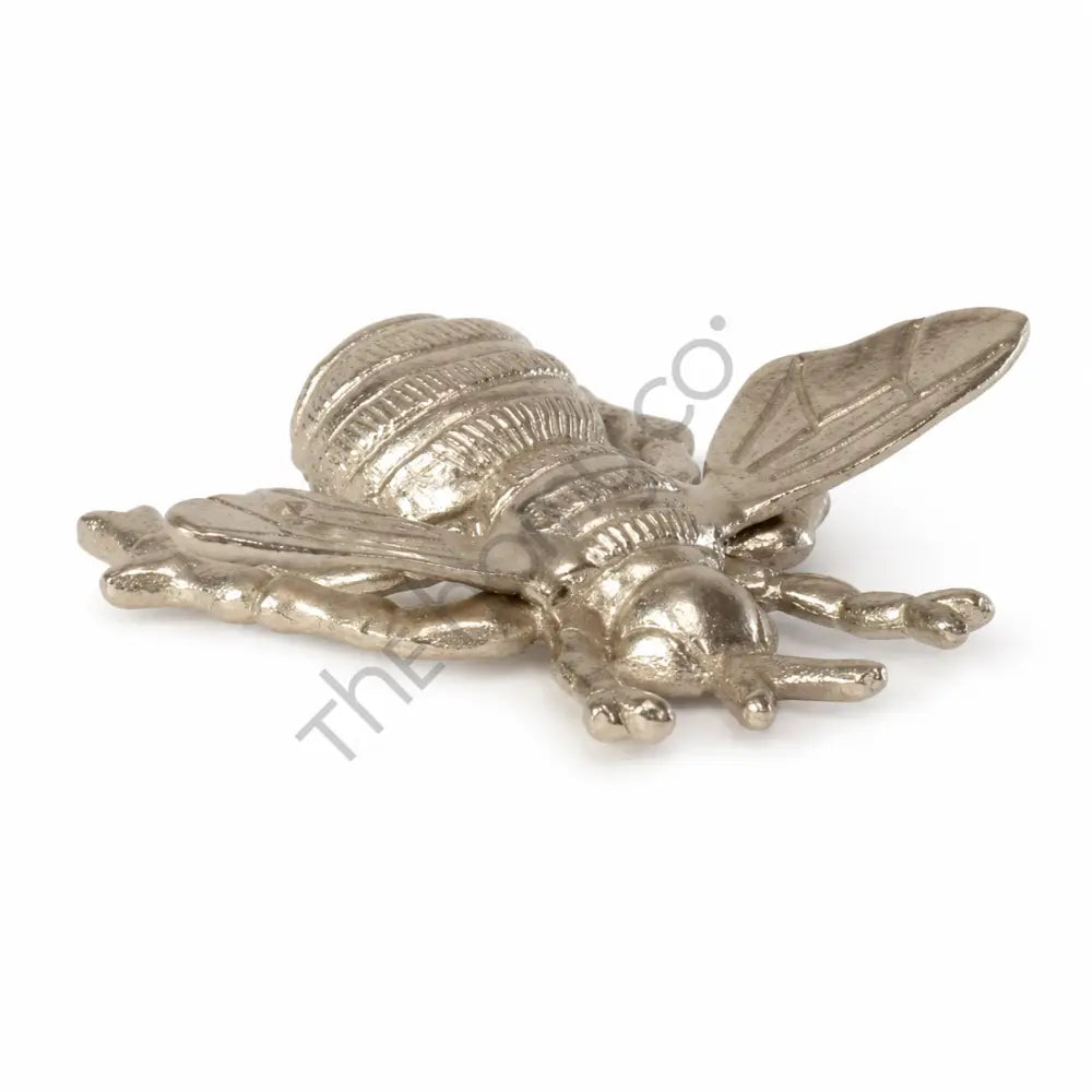 Elegant gold bee decorative tray and metal trinket dish for jewelry storage.
