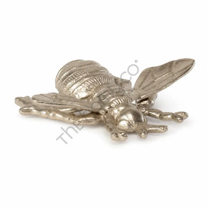 Elegant gold bee decorative tray and metal trinket dish for jewelry storage.