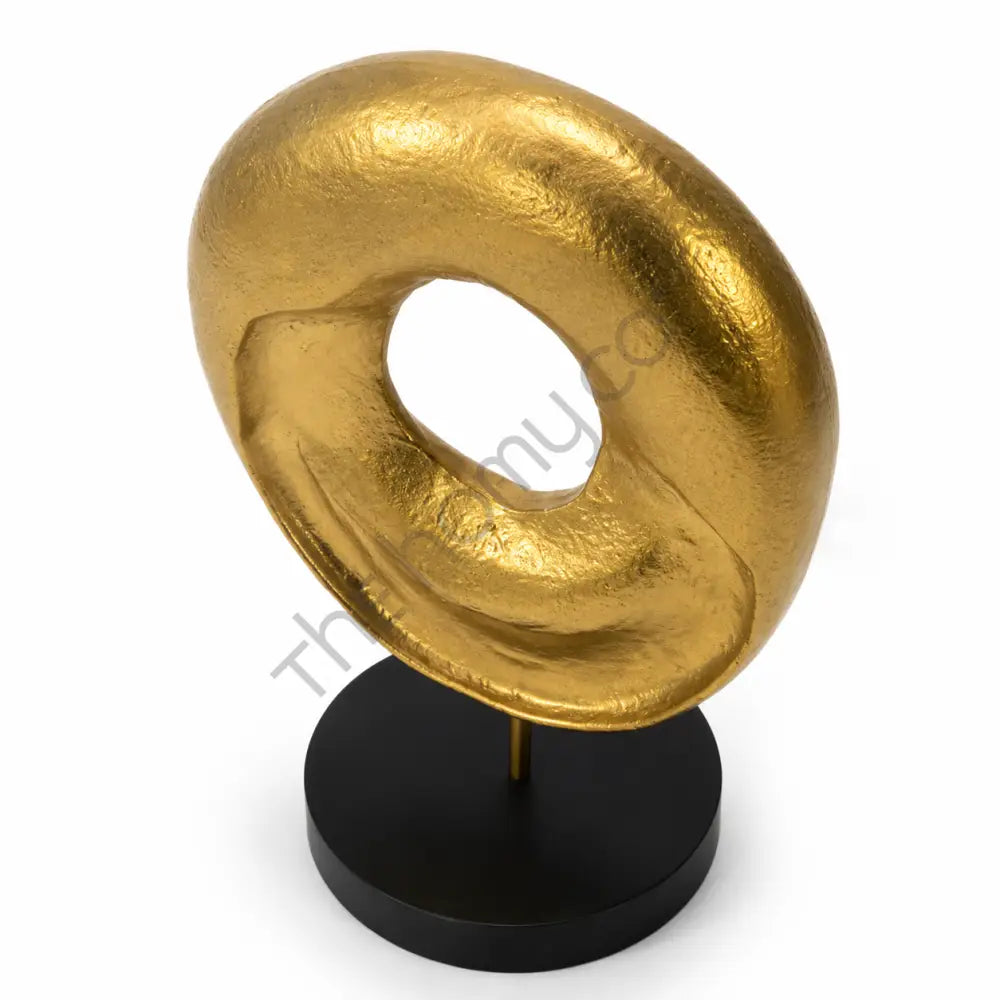 Modern abstract gold sculpture with a textured circular design on a matte black base for contemporary home decor. - 2