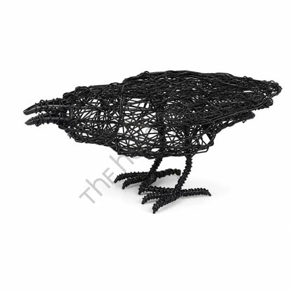 Handcrafted matte black wire crow sculpture with a minimalist open-frame design for modern tabletop decor.