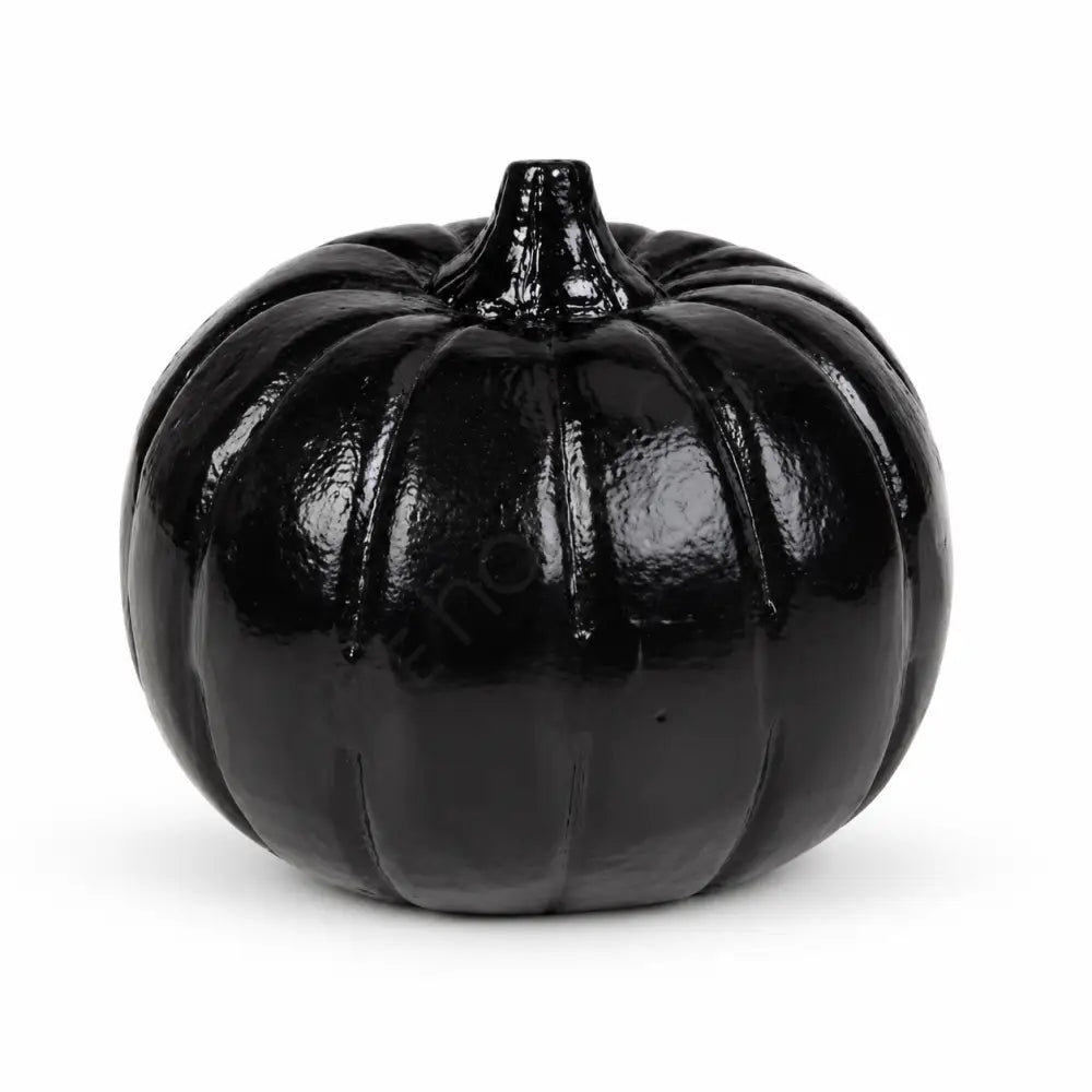 Modern glossy black pumpkin decoration with a sculpted design for minimalist Halloween home decor.