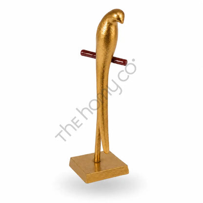 Modern gold metal parrot sculpture on a sleek stand for contemporary home and office decor. - 2
