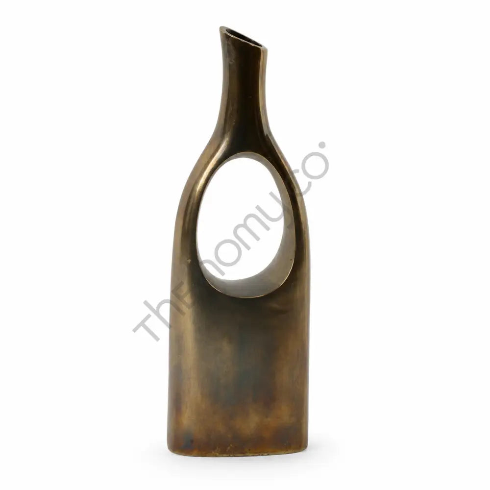 Modern sculptural bronze metal vase with a hollow cut-out design for contemporary home decor.