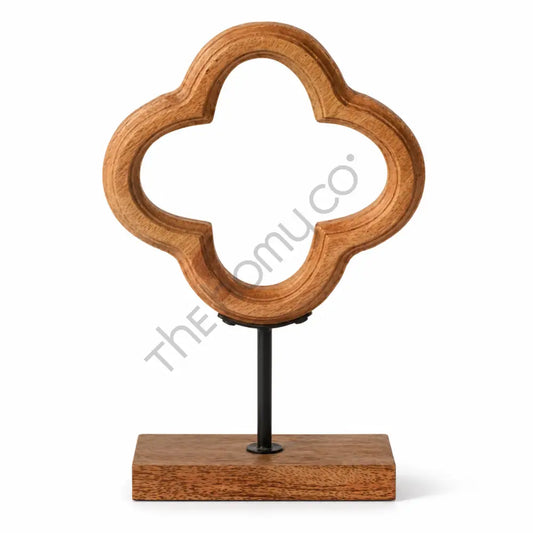 Modern wooden abstract sculpture with a geometric silhouette on a sleek metal stand for contemporary home decor.