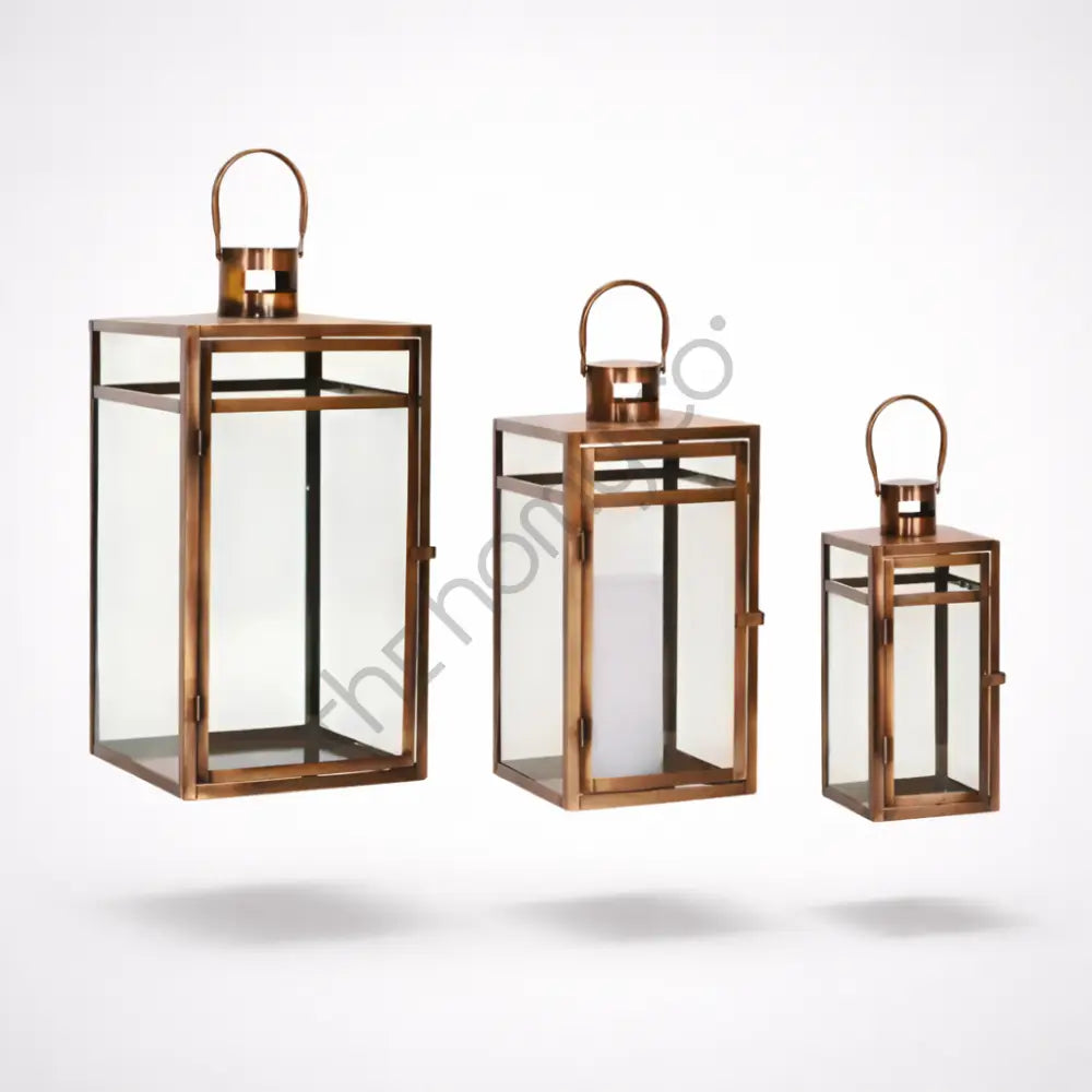 Bronze Moroccan iron lantern set with clear glass panels for festive candle holder decor.