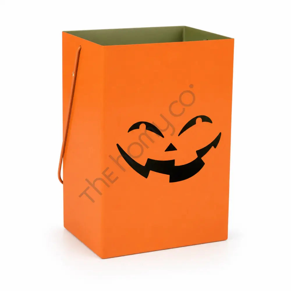 Orange metal jack-o-lantern lantern bag with a smiling pumpkin face cutout for Halloween home decor.